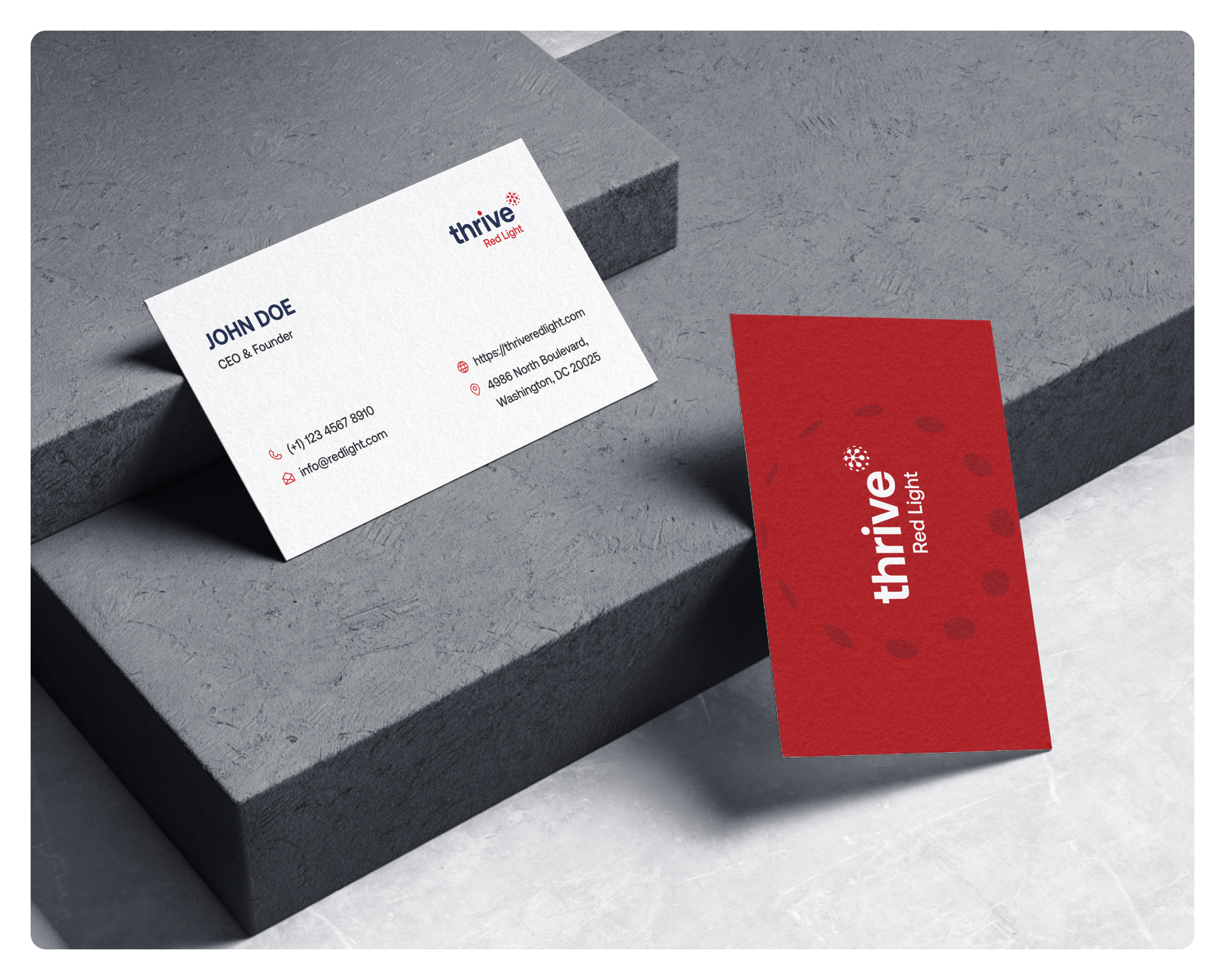 Original Thrive business-card designs arranged on architectural steps